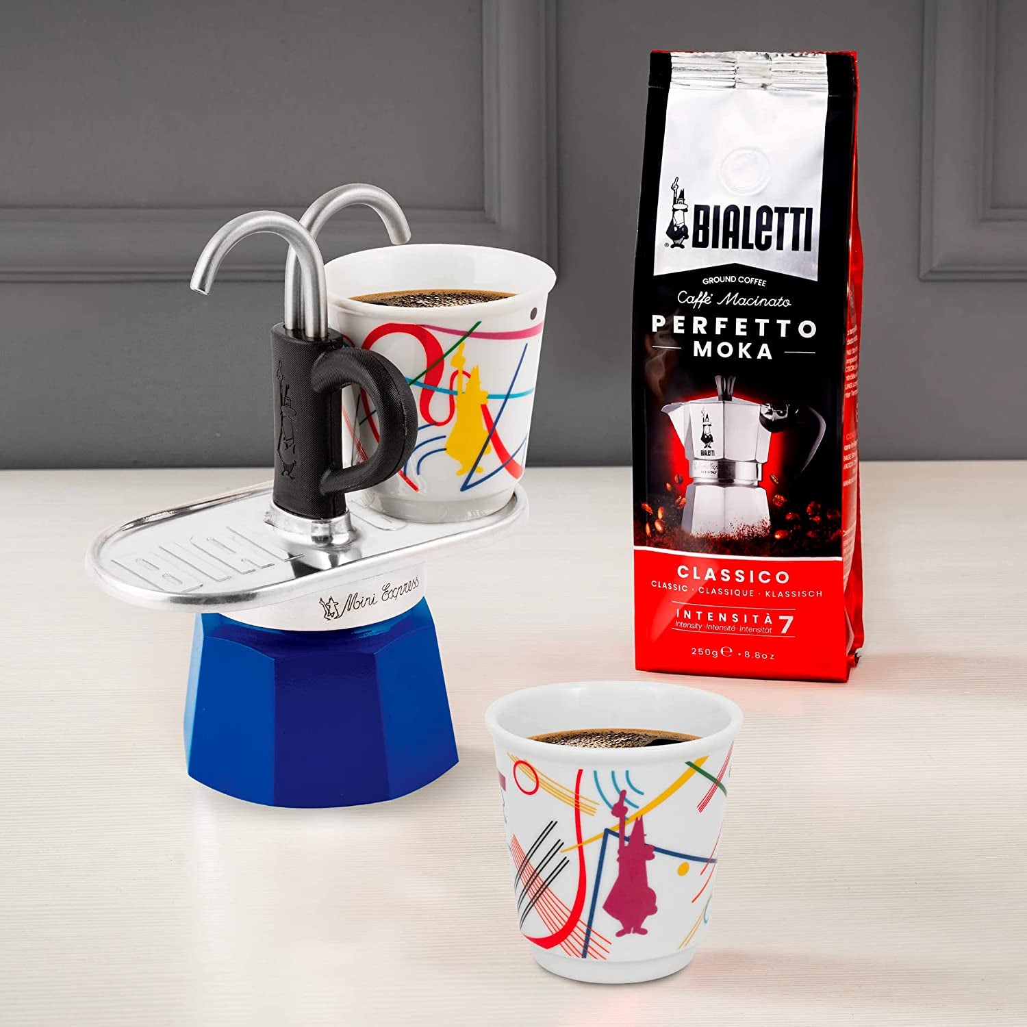 - Mini Express Kandinsky: Moka Set Includes Coffee Maker 2-Cups (2.8 Oz) + 2 Shot Glasses, Light Blue, Aluminum